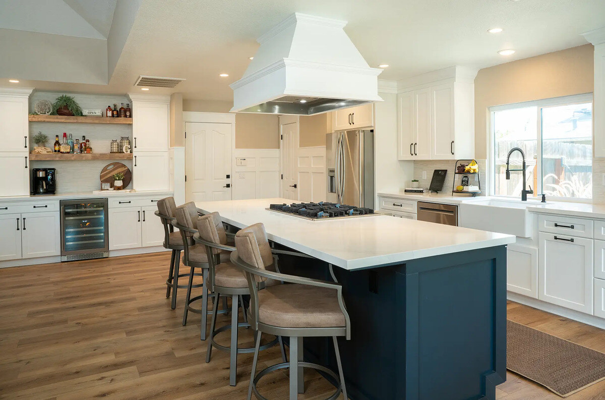 Island with stove and seating in Fresno, CA kitchen remodel by Imagine Remodeling