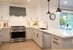 White kitchen remodel in Fresno, CA by Imagine Remodeling with task lighting