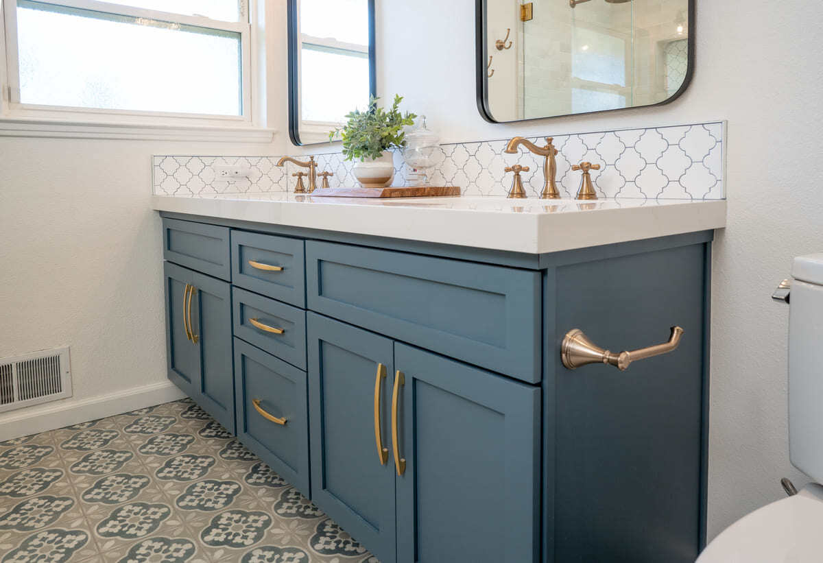 Double vanity with brass fixtures in Fresno, CA bathroom remodel by Imagine Remodeling