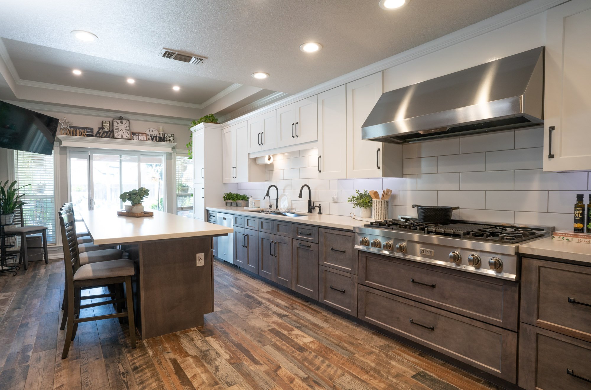 Two-tone kitchen remodel with island in Fresno, CA by Imagine Remodeling