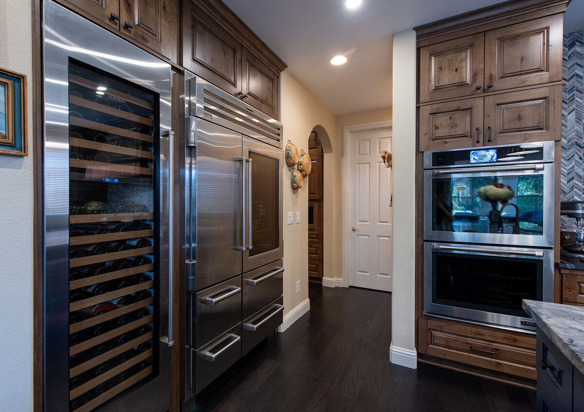 Wine fridge and double oven in Fresno, CA kitchen remodel by Imagine Remodeling